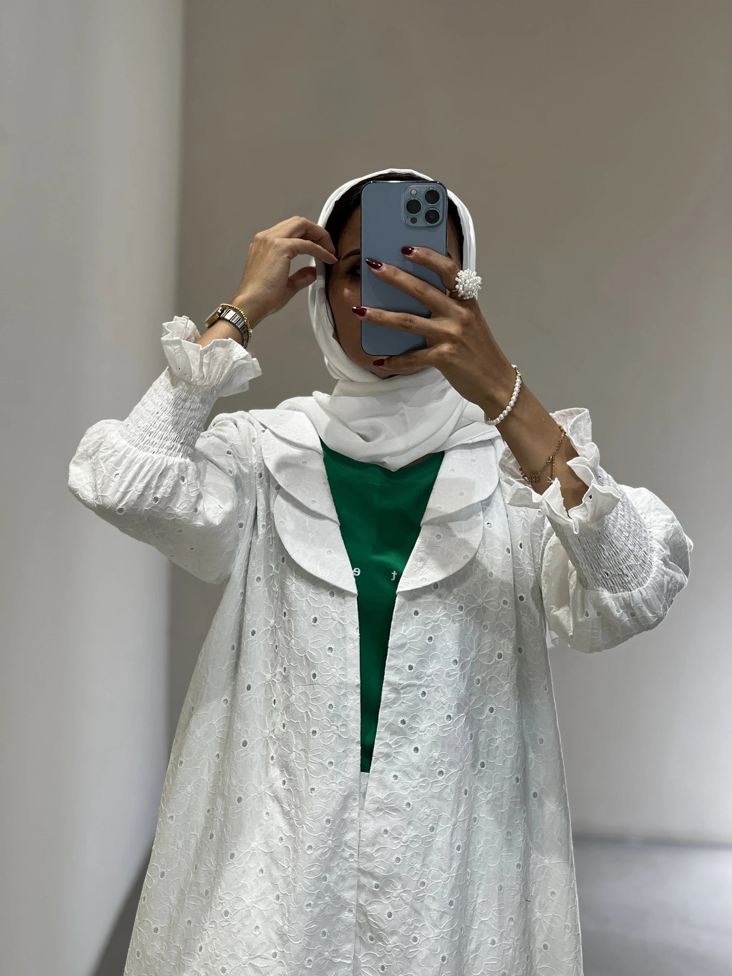 Elegant white abaya full set Dubai with ruffled sleeves and matching hijab for a sophisticated look