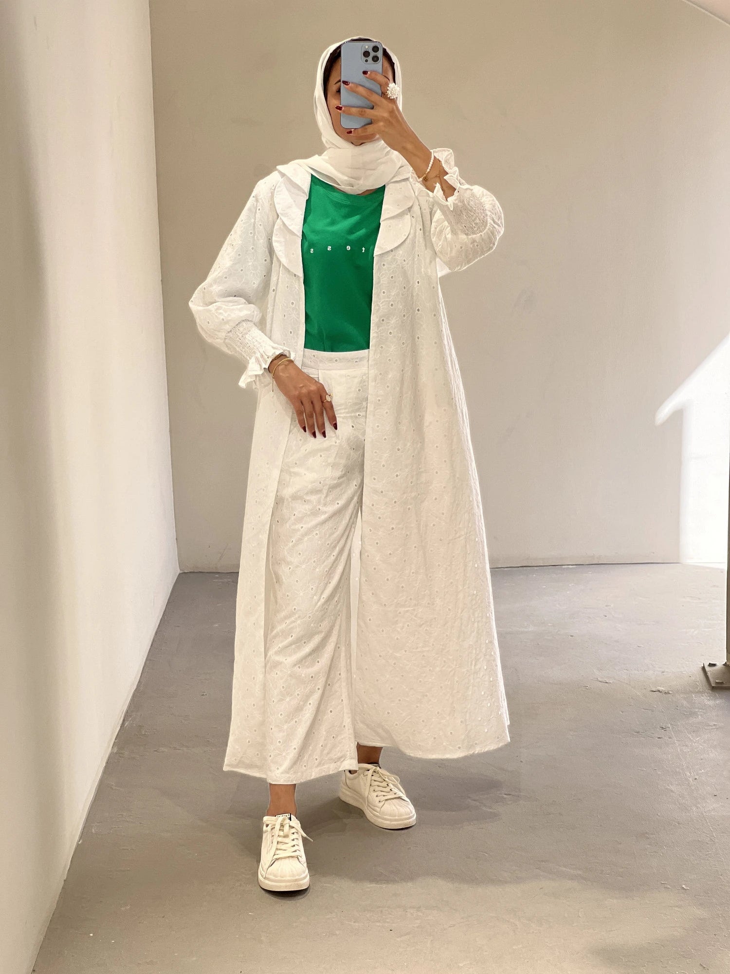 Contessa Collection abaya full set Dubai featuring a long white coat and matching pants with a green top