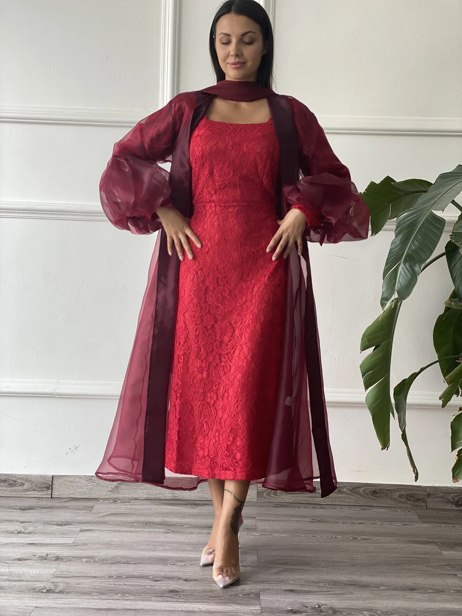 Elegant red abaya with underdress Dubai featuring sheer sleeves and a stylish silhouette