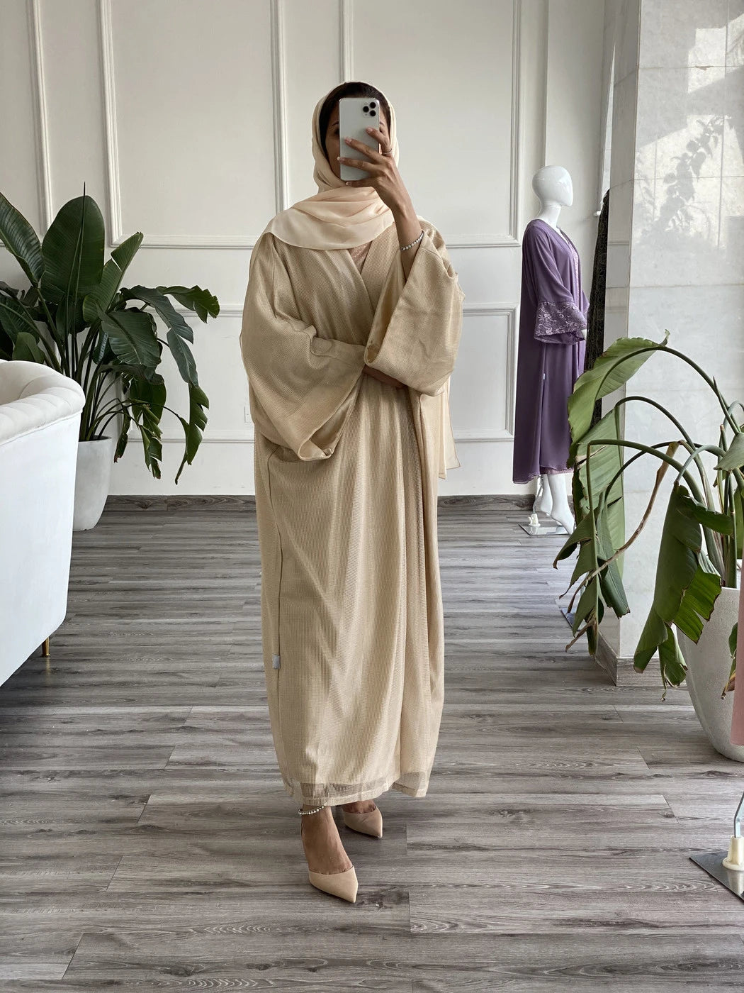 Elegant beige abaya with underdress, featuring flowing sleeves and stylish design for modest fashion.