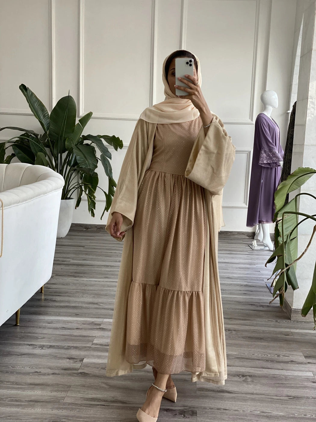 Elegant beige abaya with underdress featuring a tiered design and stylish sleeves