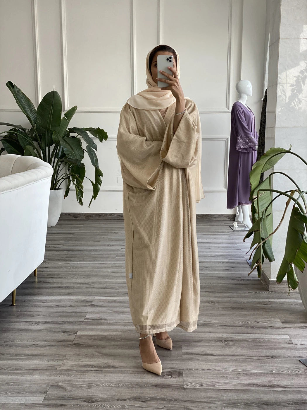 Beige abaya with underdress featuring elegant design and soft fabric for stylish modest wear