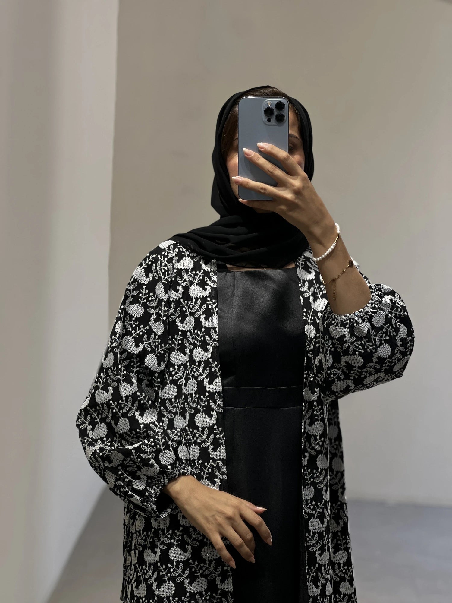 Elegant luxury abaya Dubai in black and white floral design, perfect for stylish occasions