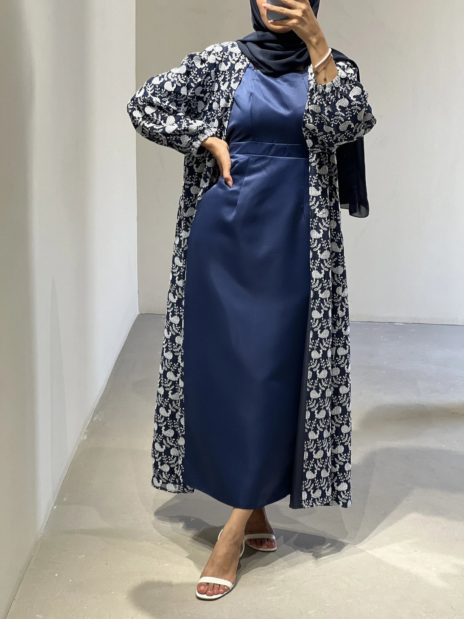 Luxury abaya Dubai in navy blue with floral print and elegant design, perfect for special occasions