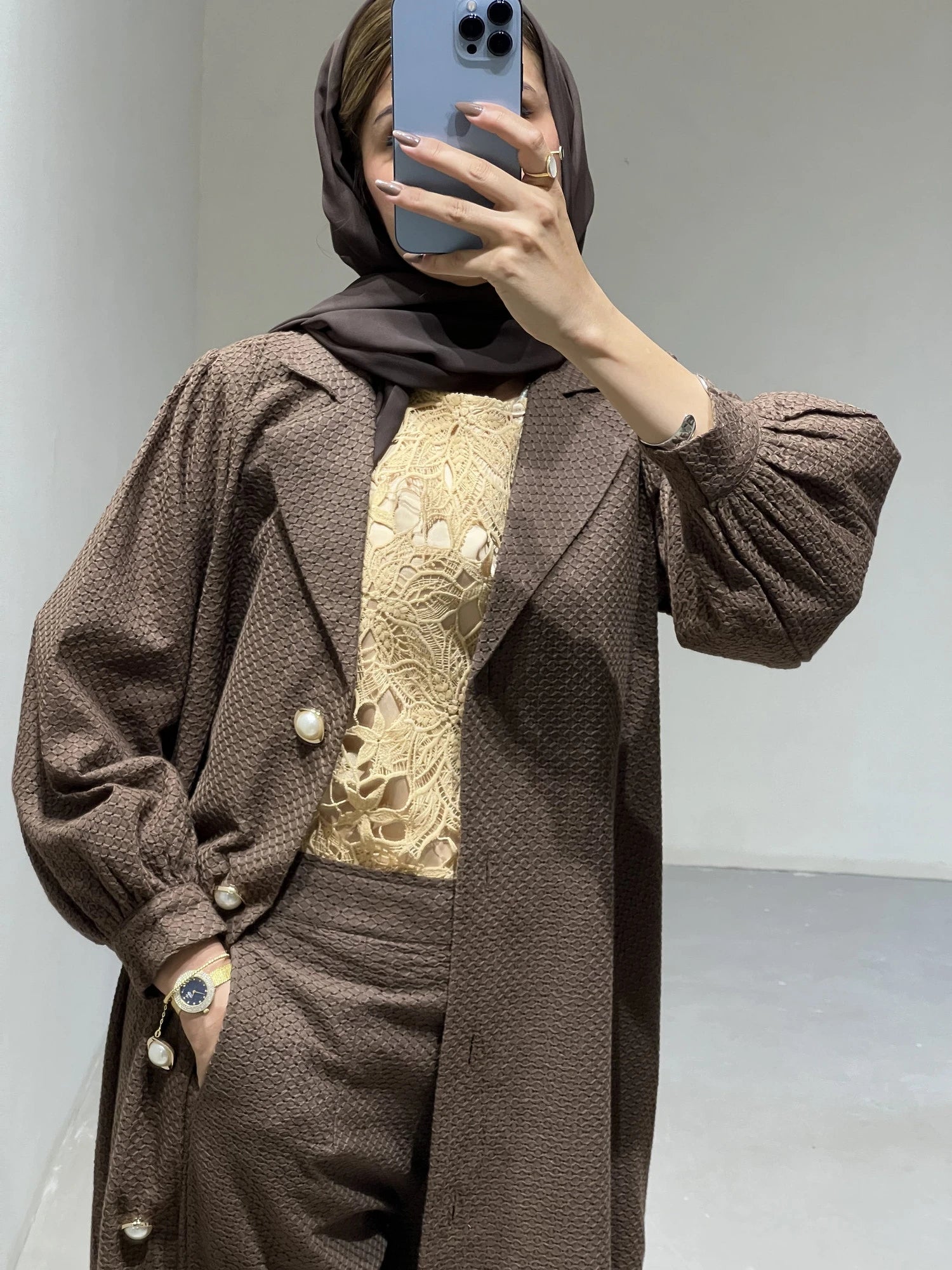 Elegant luxury abaya set Dubai in brown with decorative buttons and intricate lace detailing