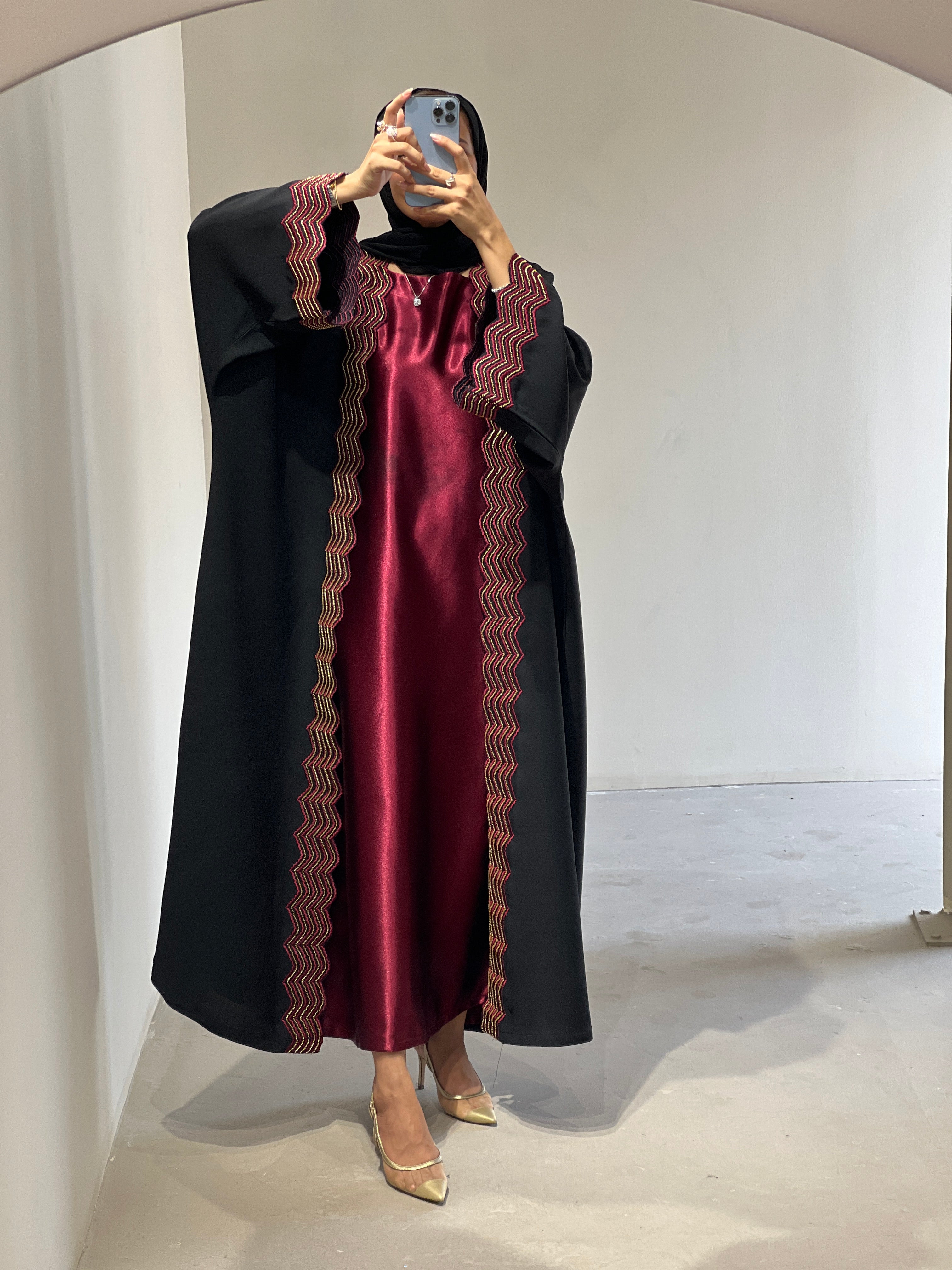 Elegant luxury abaya set with dress and sheila featuring intricate gold detailing and rich colors