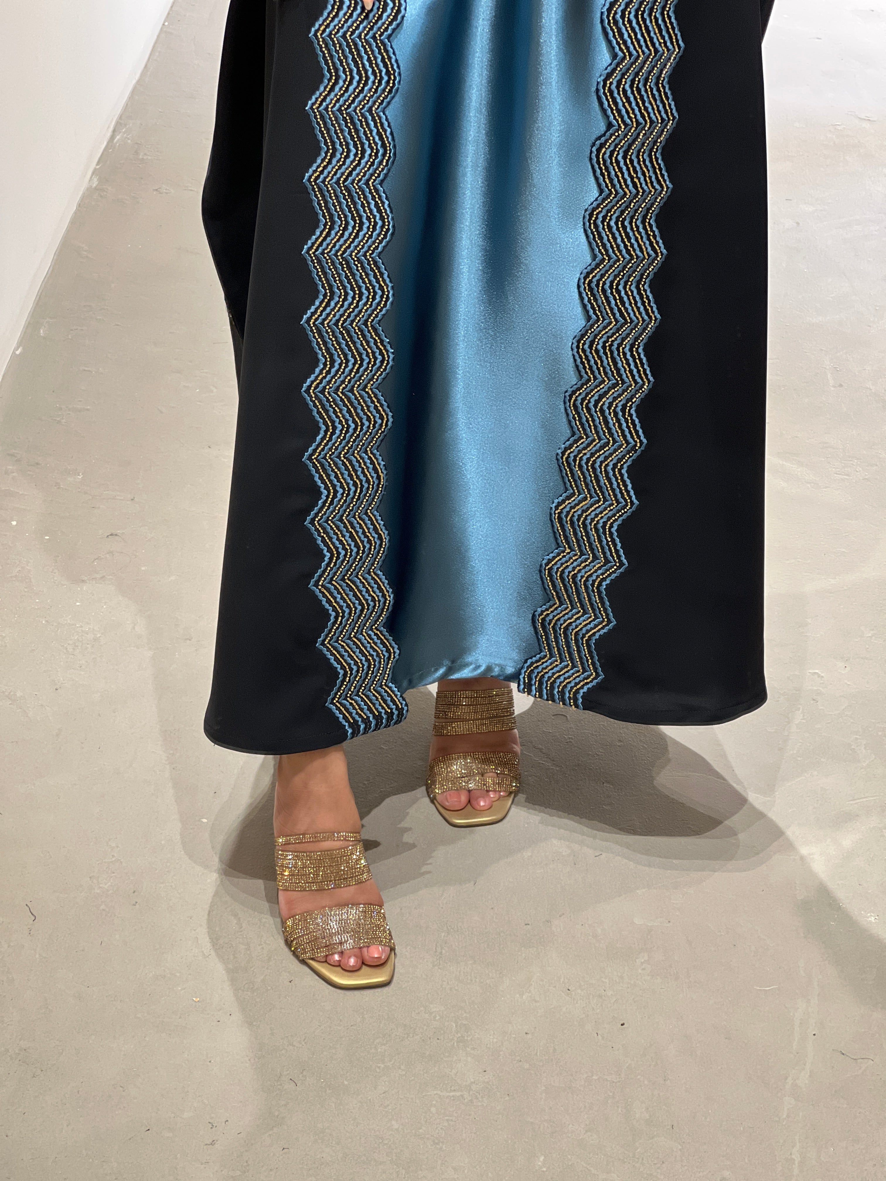 Elegant luxury abaya set with dress and sheila featuring intricate detailing and stylish sandal footwear