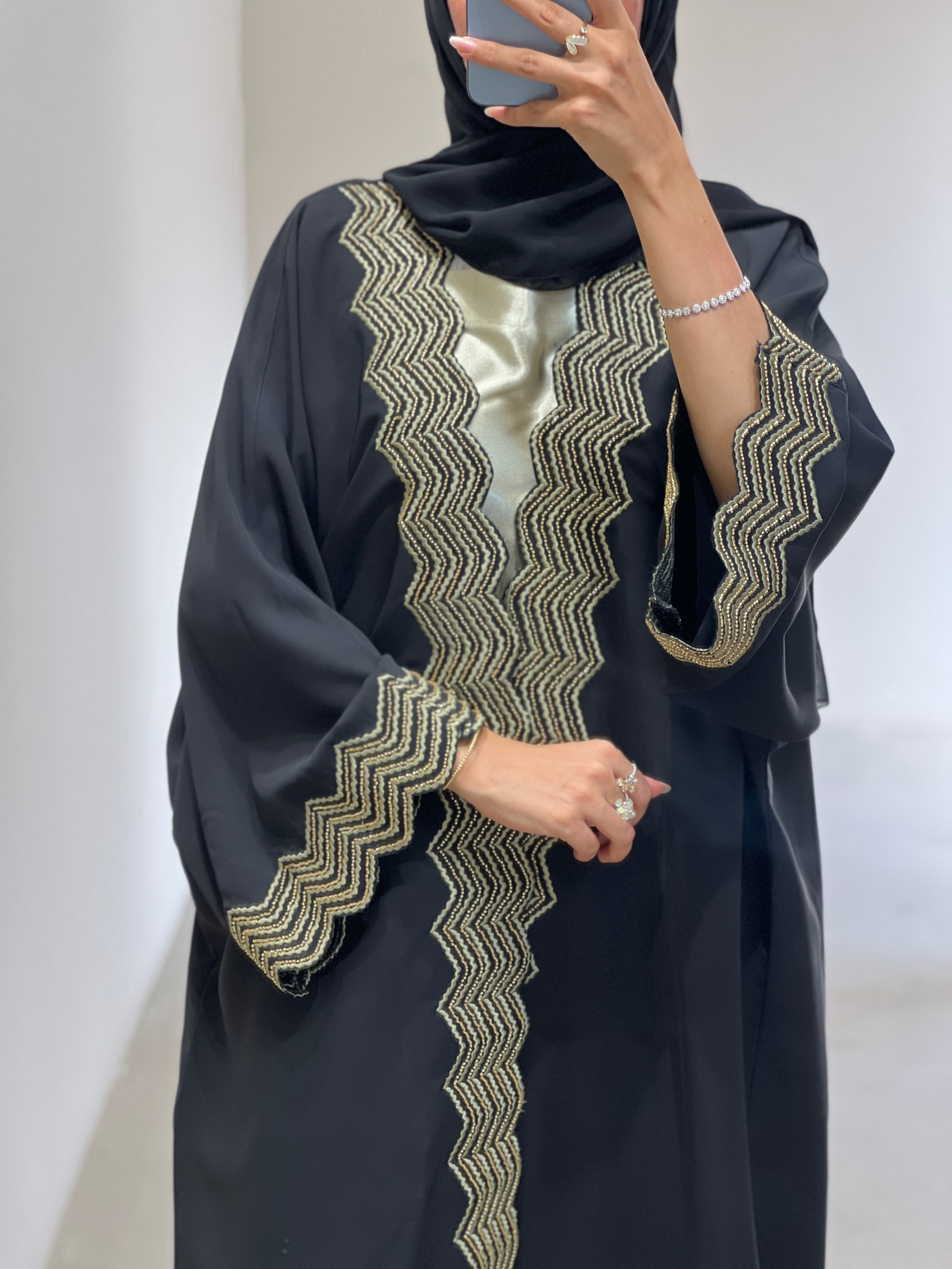 Elegant luxury abaya set with dress and sheila featuring intricate golden embroidery details